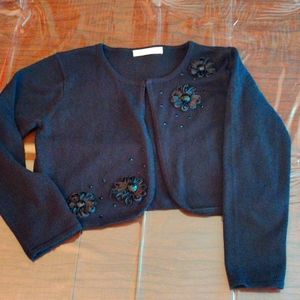Black crop long sleeve shrug with applique, size 10/12